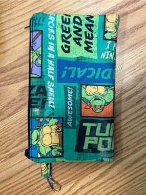 TMNT themed zipper wallet or wristlet featuring comic book style graphics